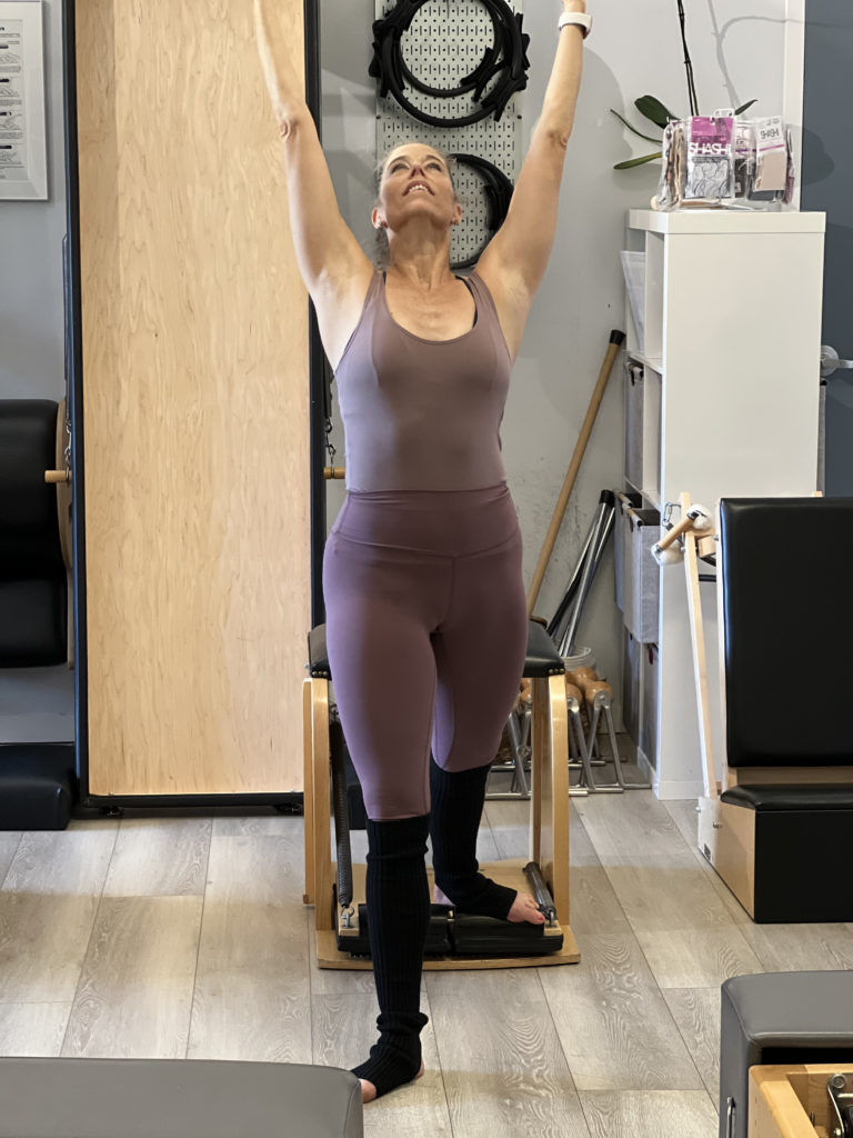 Pilates teacher Cynthia Bahmani enjoying Pilates self-care in Wunda Chair class.